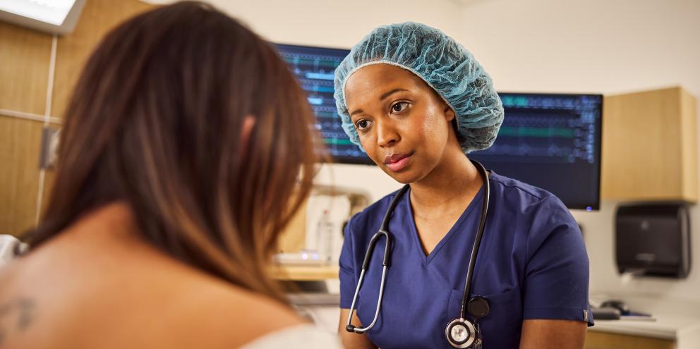Clinician talking with a patient