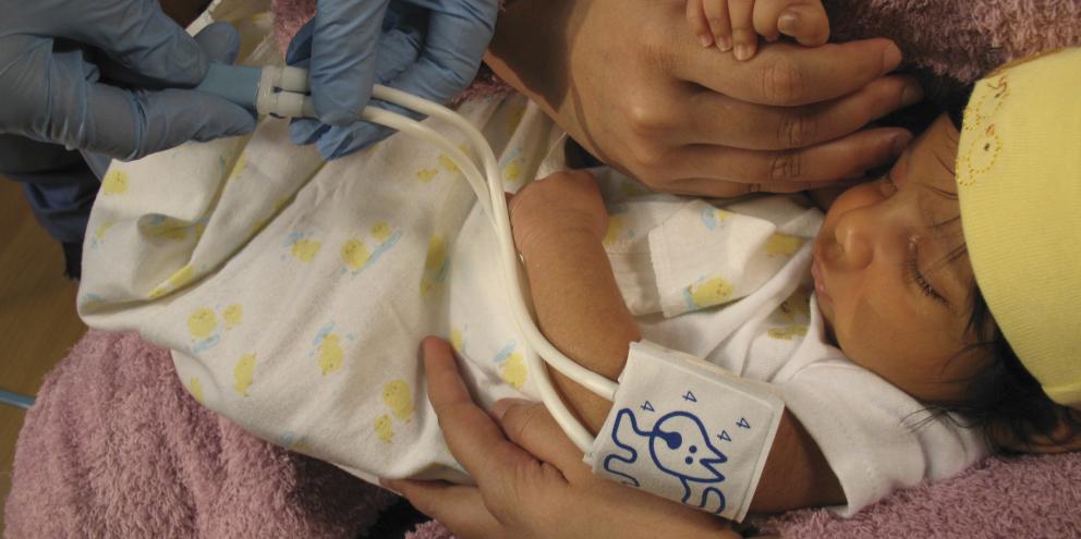 Clinician measuring blood pressure in a baby