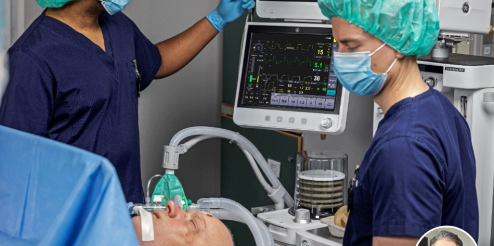 Two clinicians in the operating room with an anesthetized patient