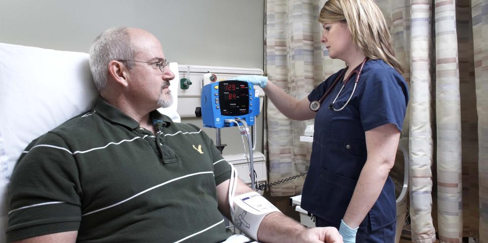 Nurse checking the blood pressure of a patient