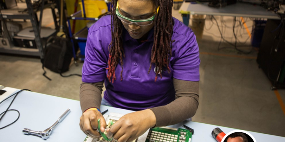 Clinical engineer repairing the electrical wiring of a medical device