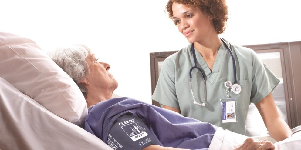 Clinician taking care of a woman with a cuff