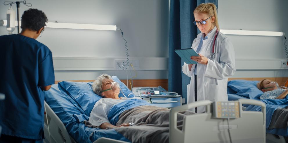 Female doctor taking care of an ICU patient