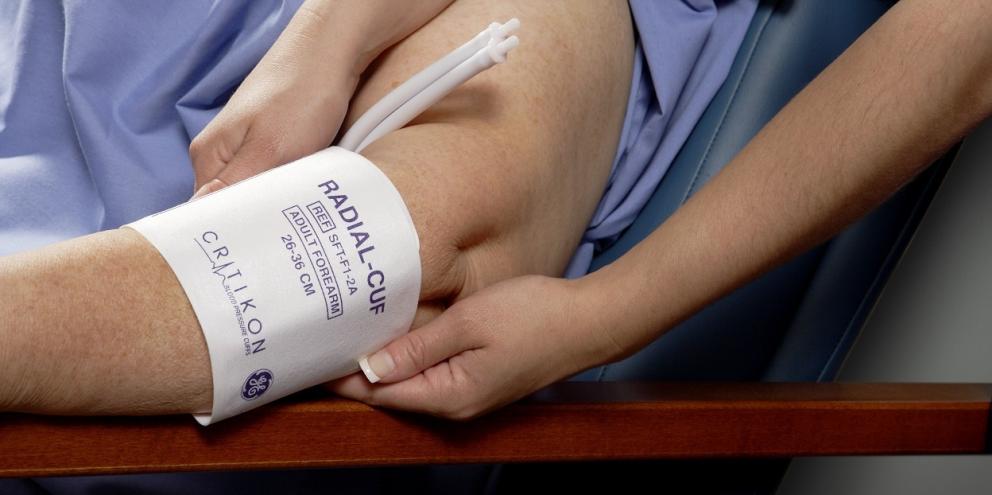 Clinician placing a cuff on a patient