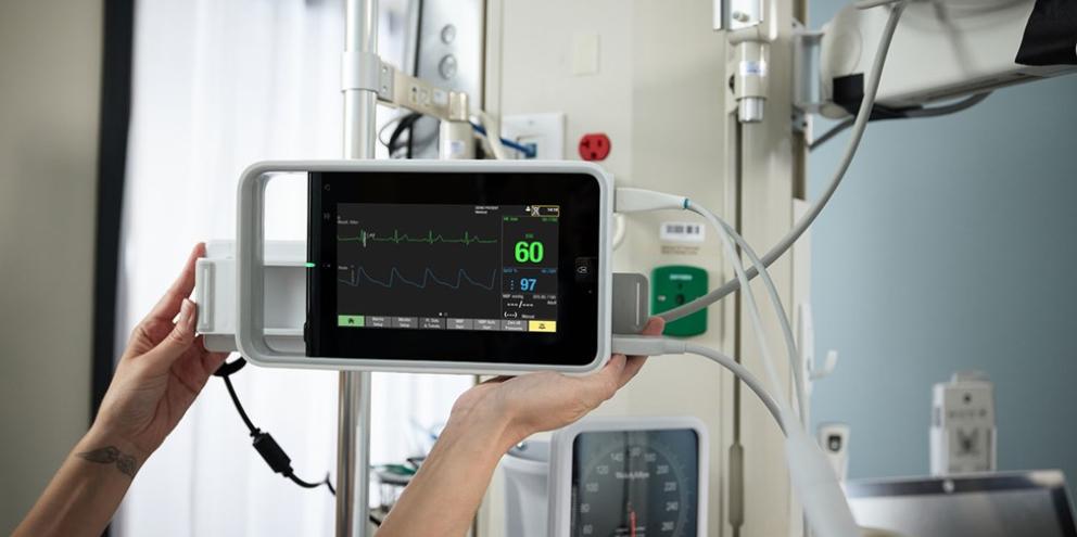 Clinician holding a patient monitor