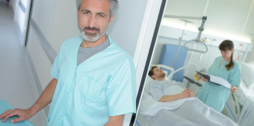 Clinicians taking care of patient in critical condition post-operatively