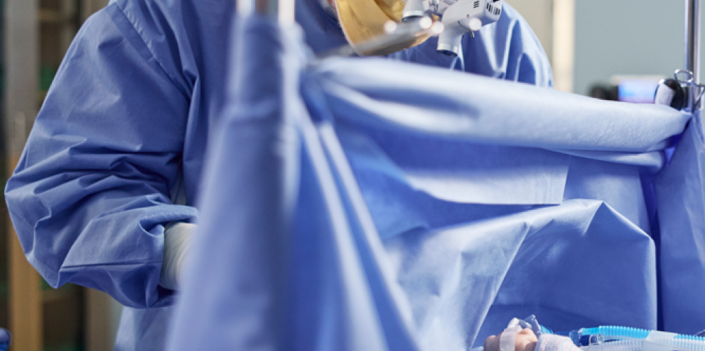 Surgeon operating on a pediatric patient