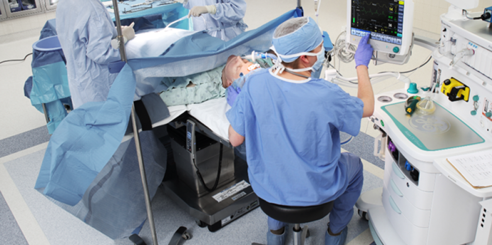 Clinicians operating a patient in the OR