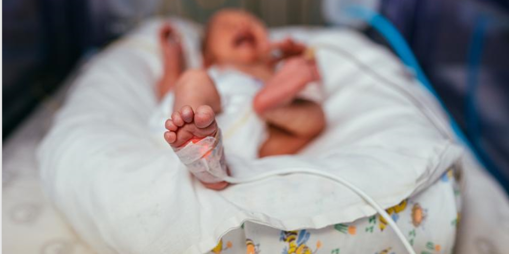 Infant patient on an incubator