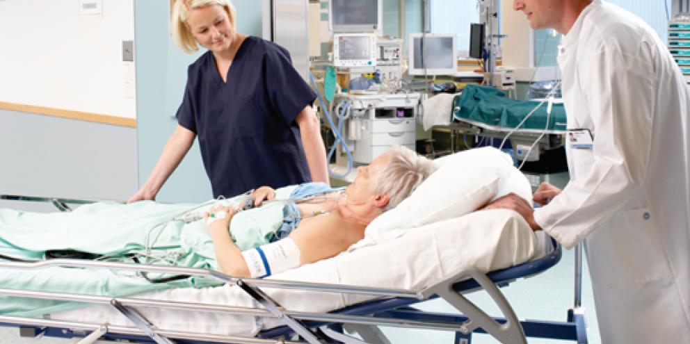 Women with an ECG being transported by two clinicians