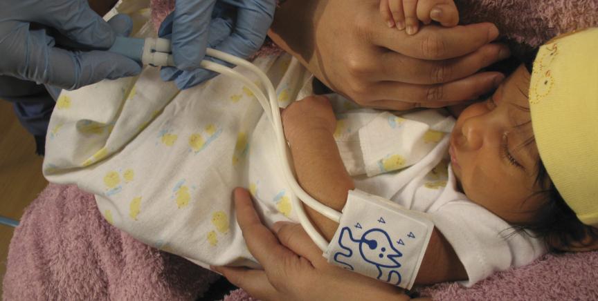 Clinician measuring blood pressure in a baby