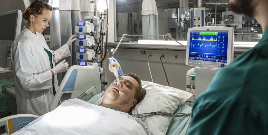 Clinicians taking care of an ICU ventilated patient 