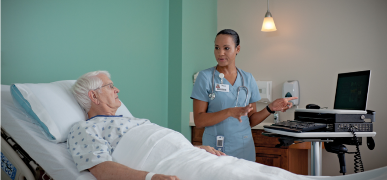 Nurse and patient talking in the ward