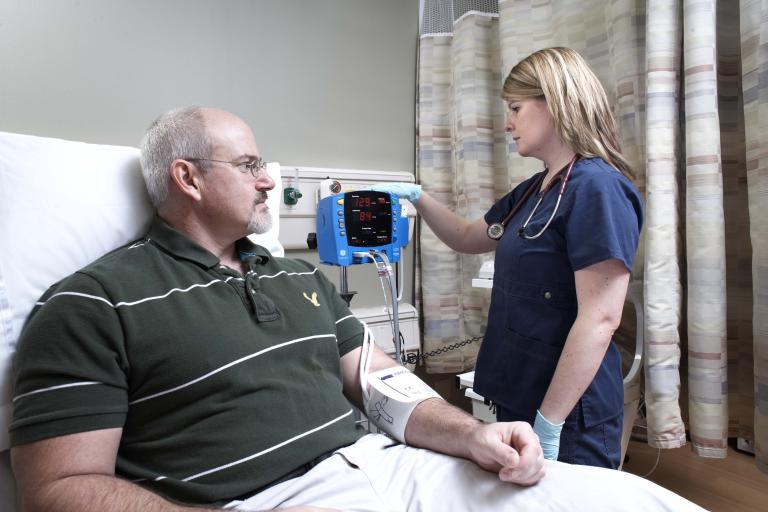 Nurse checking the blood pressure of a patient