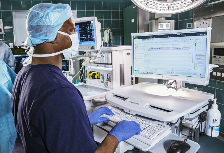 Clinician looking at a screen in the OR