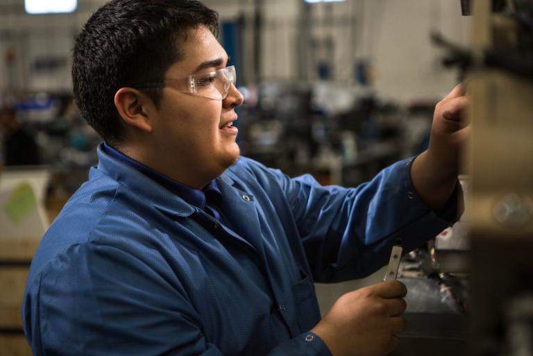 Clinical engineer repairing a medical device