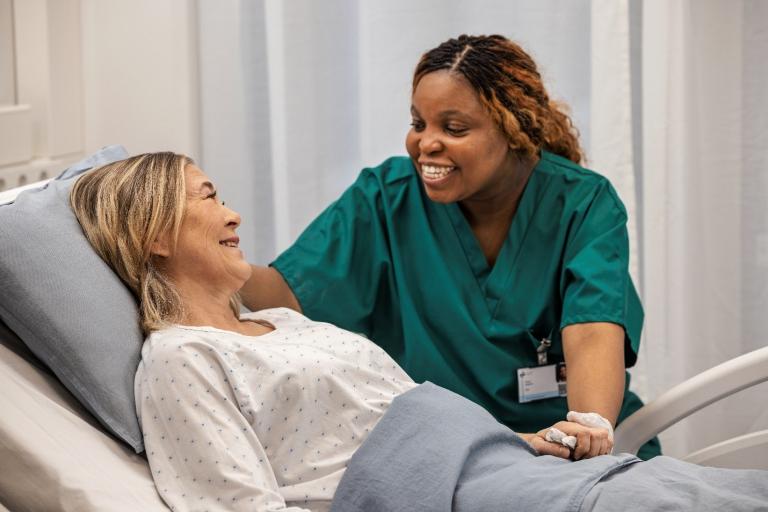 Clinician with patient on the ward