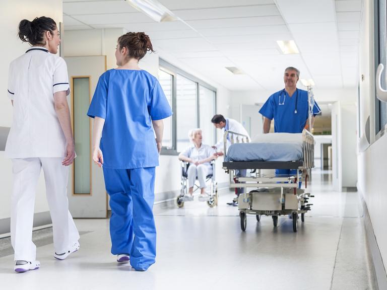 Hospital corridor with hospital employees