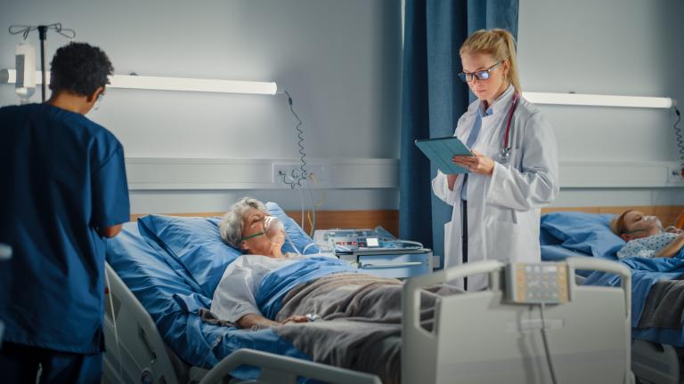 Female doctor taking care of an ICU patient