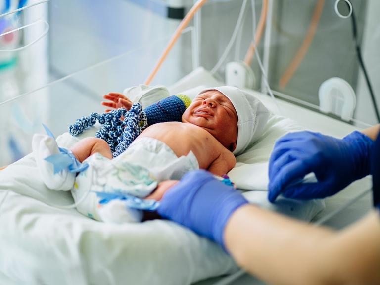 Neonatal patient in an incubator
