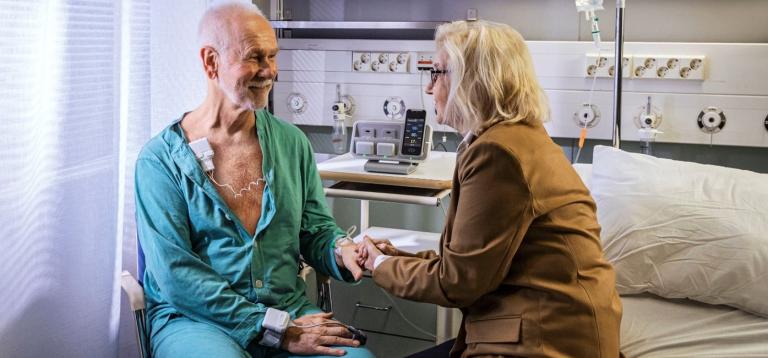 Patient and spouse in a hospital room