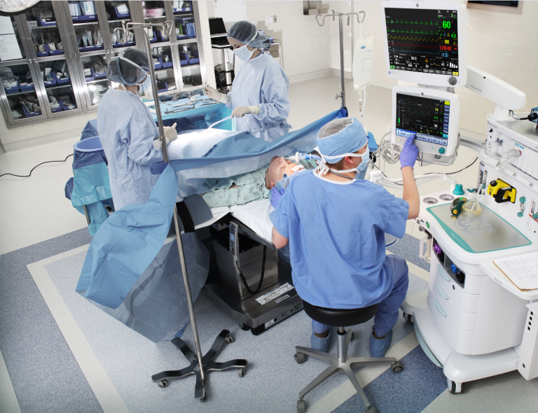 Clinicians operating a patient in the OR