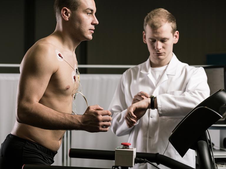 Man running on a treadmill doing a stress test ECG