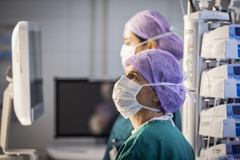 Clinicians looking at a screen