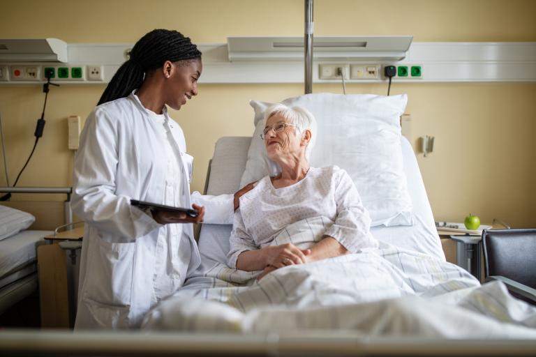 Nurse taking care of an elder woman