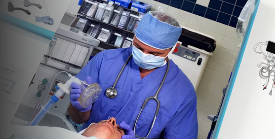 Clinician anesthetizing a patient