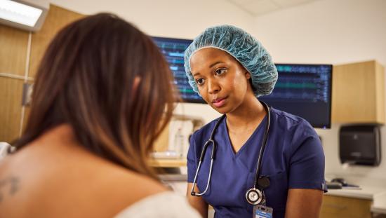 Clinician talking with a patient