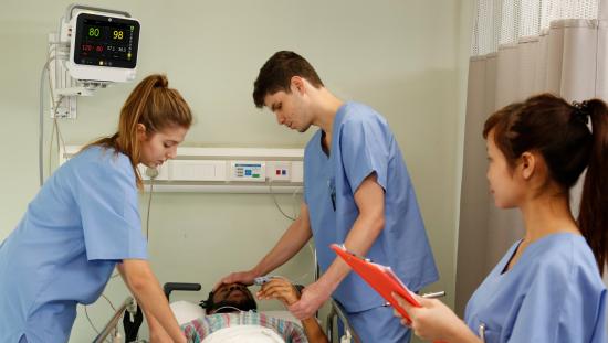 Clinicians taking care of a patient in the Emergency Department