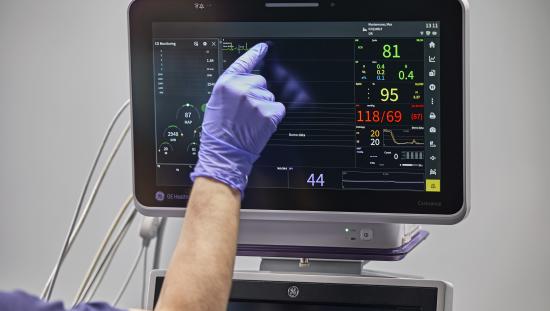 Clinician touching Carevance screen