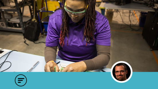 Clinical engineer repairing the electrical wiring of a medical device