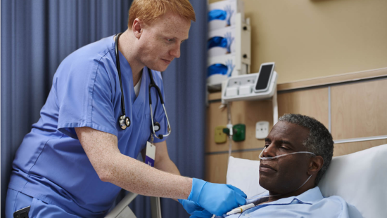 Clinician taking care of an oxygenated patient