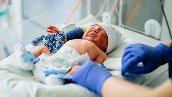 Neonatal patient in an incubator