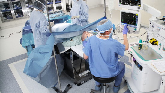 Clinicians operating a patient in the OR