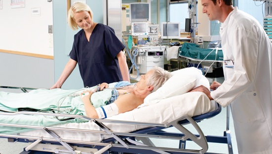 Women with an ECG being transported by two clinicians