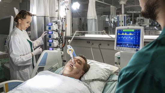 Clinicians taking care of an ICU ventilated patient 
