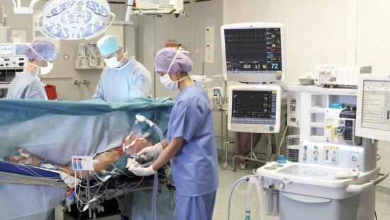 Clinicians taking care of a patient in the OR 