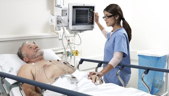 Clinician taking care of a patient with an ECG