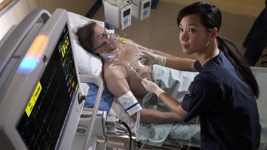 Clinician taking care of a patient with respiratory support