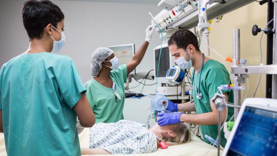 Clinicians taking care of a ventilated patient in the ICU