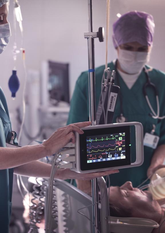 Clinicians transporting a patient to the OR